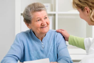Senior patient talking with her doctor.